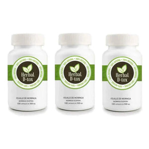 L'image montre trois flacons de "Herbal D-tox" contenant chacun 100 gélules de 500 mg de feuilles de moringa (Moringa oleifera).